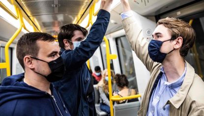 People wear mask on a metro train in Copenhagen shortly after midnigh