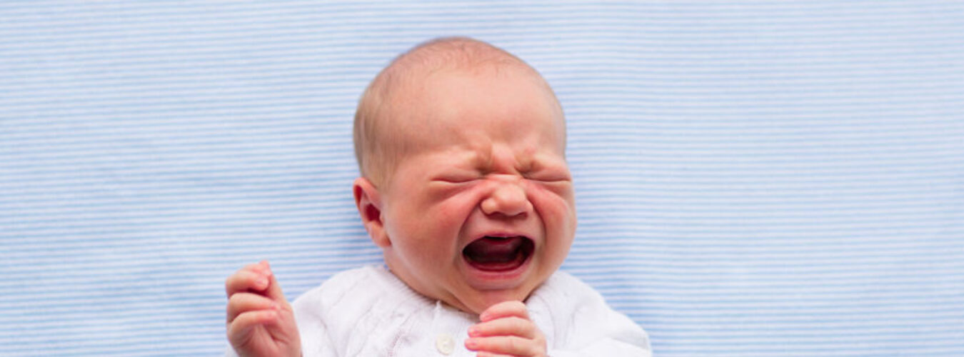 Newborn baby boy on a blue blanket