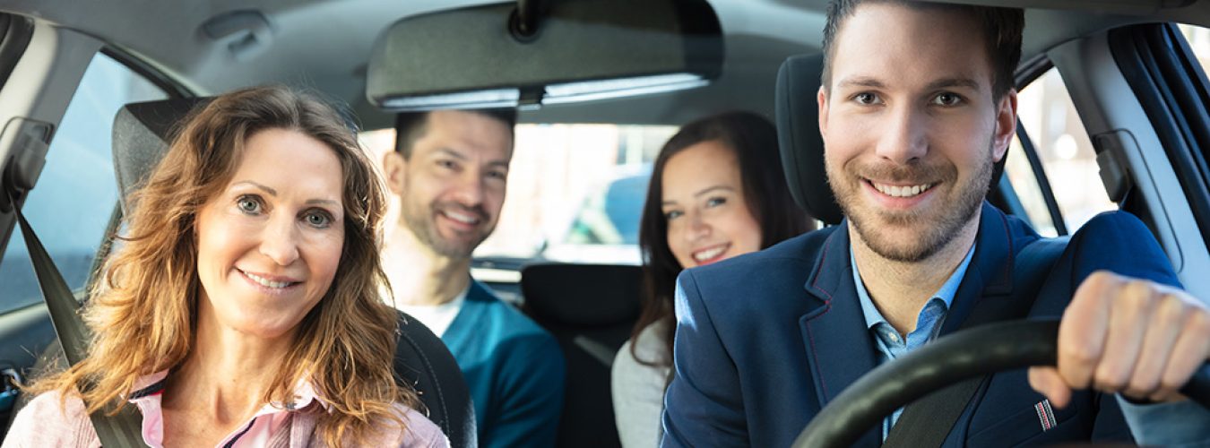 Smiling People Sitting In Car