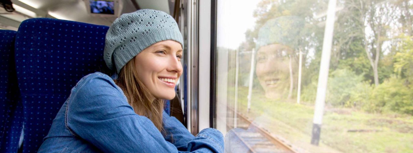 woman-on-train-looking-out-window