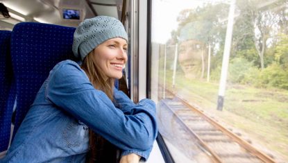 woman-on-train-looking-out-window