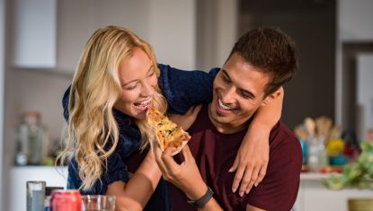 Couple enjoying eating pizza