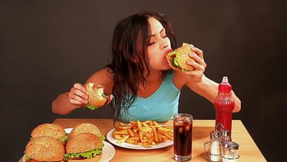 woman-eating-junk-food-1024×576