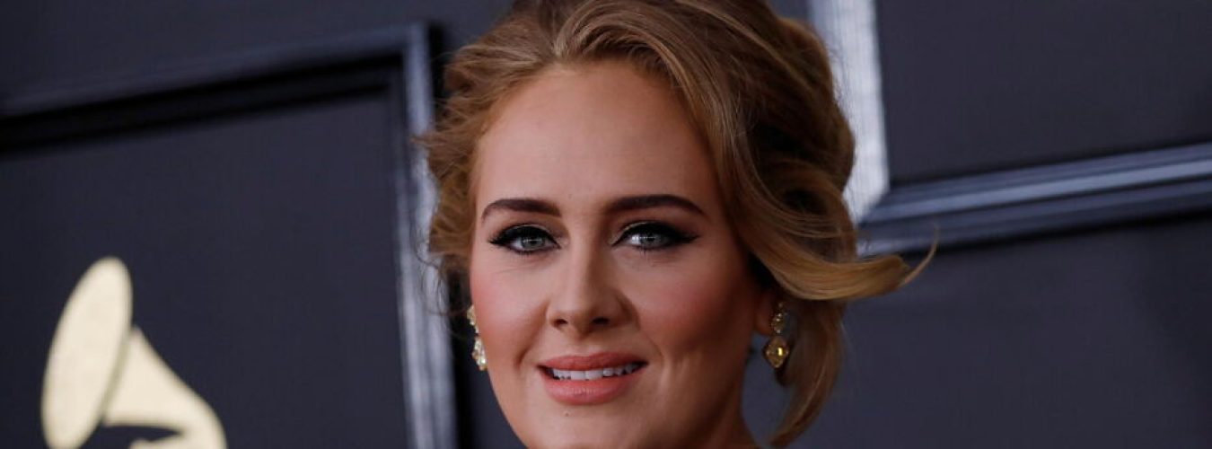 FILE PHOTO: Singer Adele arrives at the 59th Annual Grammy Awards in Los Angeles