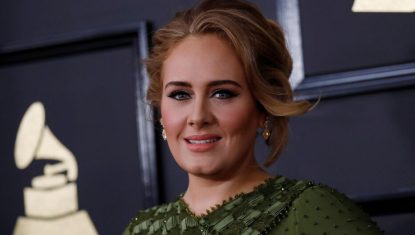 FILE PHOTO: Singer Adele arrives at the 59th Annual Grammy Awards in Los Angeles